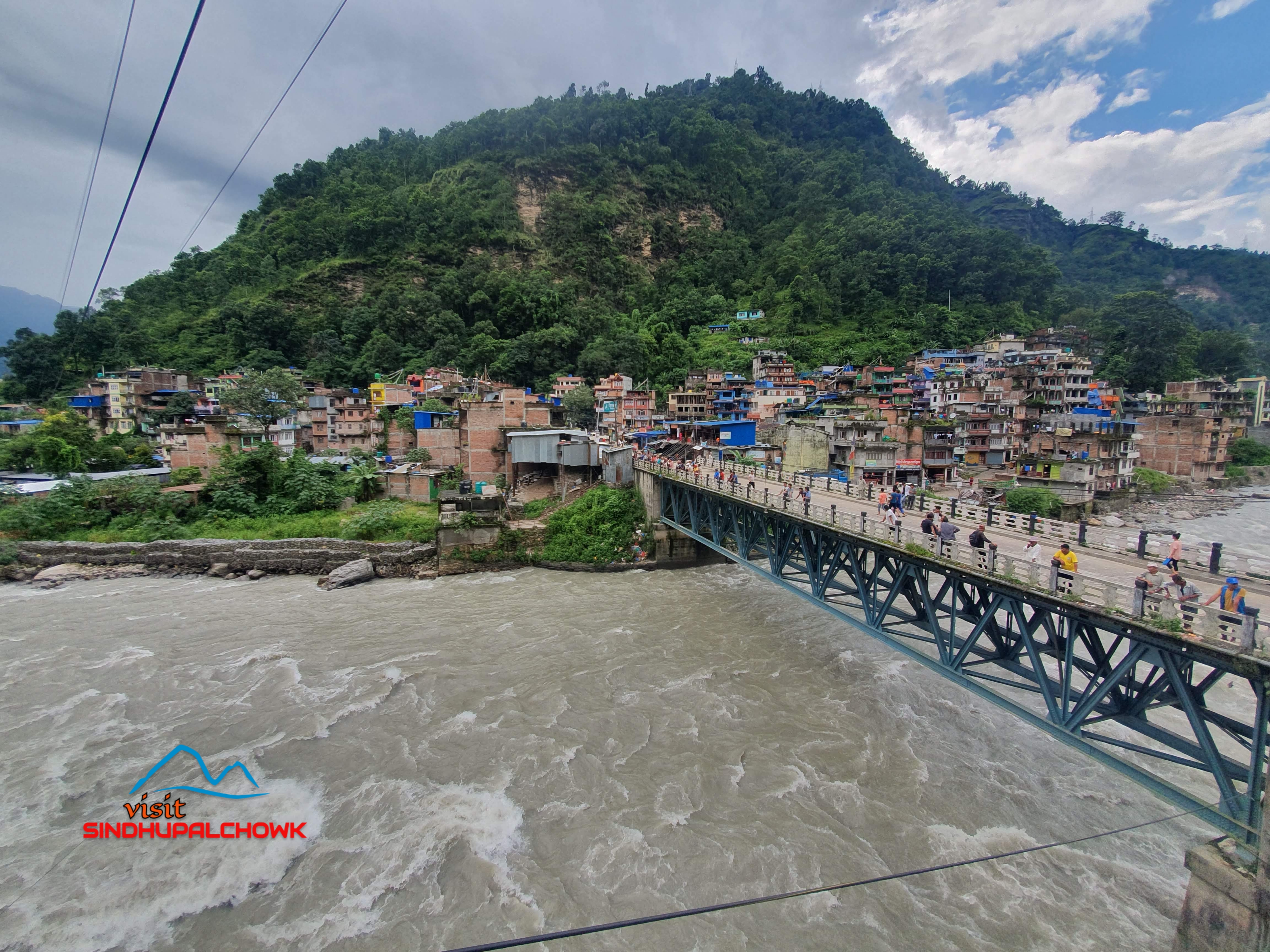 A view of Barhabishe Bazar, a busy riverside town surrounded by hills in Sindhupalchowk.